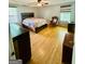 Spacious main bedroom with wood floors, ceiling fan and lots of natural light from the windows at 2527 Amalfi Dr, Conyers, GA 30012