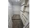 Carpeted walk-in closet offering ample storage space with shelving and rods at 2527 Amalfi Dr, Conyers, GA 30012