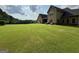Vast backyard featuring well-maintained lawn perfect for recreation and relaxation at 116 Standford Dr, Mcdonough, GA 30252
