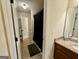 Bathroom featuring tiled floors, granite vanity, and shower with black shower curtain at 116 Standford Dr, Mcdonough, GA 30252