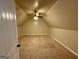 This is a bedroom with neutral colored walls, carpet and a ceiling fan at 116 Standford Dr, Mcdonough, GA 30252
