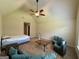 This is a spacious bedroom with a high ceiling, ceiling fan, couches, bed and a window at 116 Standford Dr, Mcdonough, GA 30252