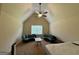 This is a spacious bedroom with a high ceiling, ceiling fan, a window and couches at 116 Standford Dr, Mcdonough, GA 30252