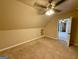This is a bedroom with neutral colored walls, carpet and a ceiling fan at 116 Standford Dr, Mcdonough, GA 30252