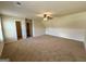 Spacious bonus room with neutral walls, carpet, and a ceiling fan at 116 Standford Dr, Mcdonough, GA 30252