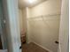 This is a standard closet with a wire shelf and neutral colored carpet at 116 Standford Dr, Mcdonough, GA 30252
