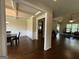 Open concept dining room featuring hardwood floors, coffered ceilings, and wainscotting at 116 Standford Dr, Mcdonough, GA 30252
