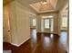 Foyer featuring hardwood floors, a glass front door, and neutral walls at 116 Standford Dr, Mcdonough, GA 30252