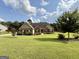 Charming home showcasing a well-maintained lawn and landscaping in the front yard at 116 Standford Dr, Mcdonough, GA 30252
