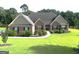 Charming brick home with well-manicured lawn and landscaping for great curb appeal at 116 Standford Dr, Mcdonough, GA 30252