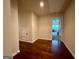 Hallway with hardwood floors leading to a bedroom; storage closet at 116 Standford Dr, Mcdonough, GA 30252