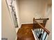 Hallway at the top of stairs featuring hardwood floors and a water heater at 116 Standford Dr, Mcdonough, GA 30252