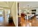 Open kitchen with a kitchen island and views of the living area and front entry at 116 Standford Dr, Mcdonough, GA 30252