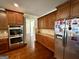 Modern kitchen with stainless steel double oven, refrigerator, and plenty of cabinet space at 116 Standford Dr, Mcdonough, GA 30252