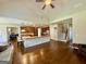 Open concept living area with kitchen island, hardwood floors, and staircase at 116 Standford Dr, Mcdonough, GA 30252