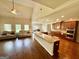 Open-concept living room and kitchen featuring hardwood floors and stainless steel appliances at 116 Standford Dr, Mcdonough, GA 30252