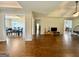 Open-concept living room boasts hardwood floors and views into the dining room at 116 Standford Dr, Mcdonough, GA 30252