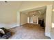 Large main bedroom featuring a tray ceiling, carpet flooring, and decorative columns at 116 Standford Dr, Mcdonough, GA 30252