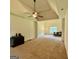 Main bedroom featuring tray ceilings, ceiling fan, large windows, and neutral-toned walls at 116 Standford Dr, Mcdonough, GA 30252