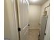 This is a small utility room with tile floors, water heater and white walls at 116 Standford Dr, Mcdonough, GA 30252