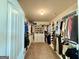 Walk-in closet with custom shelving and ample storage for shoes, clothing, and accessories at 116 Standford Dr, Mcdonough, GA 30252
