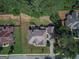 A bird's eye view of the house showing its roof, yard, and surrounding trees and neighborhood at 125 Seawright Dr, Fayetteville, GA 30215