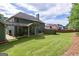 Expansive backyard with a covered patio, perfect for outdoor gatherings and relaxation at 125 Seawright Dr, Fayetteville, GA 30215