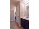 Bathroom with white walls, tile flooring, and a vanity with a sink and mirror at 125 Seawright Dr, Fayetteville, GA 30215
