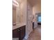 Bathroom features a vanity with a sink, medicine cabinet, and access to another bedroom at 125 Seawright Dr, Fayetteville, GA 30215