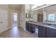 Spacious primary bathroom featuring double vanity, granite countertops, and separate tub and shower at 125 Seawright Dr, Fayetteville, GA 30215