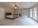 Large bedroom boasts a ceiling fan, built-in bookshelves, and abundant natural light at 125 Seawright Dr, Fayetteville, GA 30215