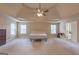 Bedroom featuring trey ceiling, ceiling fan, and large windows at 125 Seawright Dr, Fayetteville, GA 30215