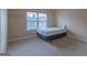Cozy bedroom features a bed and a large window with tree views and white blinds at 125 Seawright Dr, Fayetteville, GA 30215
