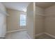 Walk-in closet with shelving for ample storage and natural light from the window at 125 Seawright Dr, Fayetteville, GA 30215