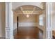 Elegant dining room featuring coffered ceilings, wainscoting, and hardwood floors at 125 Seawright Dr, Fayetteville, GA 30215