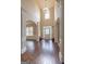 Grand foyer with hardwood floors, high ceilings, chandelier, and decorative columns at 125 Seawright Dr, Fayetteville, GA 30215