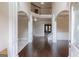 Grand foyer with hardwood floors, an open staircase, and elegant architectural details at 125 Seawright Dr, Fayetteville, GA 30215