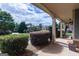 A covered front porch with stone accents, manicured landscaping, and elegant outdoor lighting at 125 Seawright Dr, Fayetteville, GA 30215