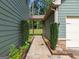 Charming walkway leading to the backyard, nestled between the main house and the garage at 125 Seawright Dr, Fayetteville, GA 30215