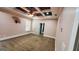 Bedroom with ceiling fan and a tray ceiling design, a window with blinds, and neutral carpet at 90 Alcovy Reserve Way, Covington, GA 30014