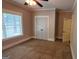 Bedroom with a window, carpeted floors, closet and bathroom door at 90 Alcovy Reserve Way, Covington, GA 30014