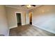 Neutral bedroom with carpeted floors, ceiling fan, with closet and bathroom doors at 90 Alcovy Reserve Way, Covington, GA 30014
