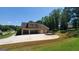 Spacious three car garage and large driveway perfect for parking multiple vehicles at 90 Alcovy Reserve Way, Covington, GA 30014