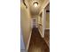 Hallway with hardwood flooring leads to other rooms in the home at 90 Alcovy Reserve Way, Covington, GA 30014