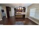 Bright kitchen featuring stainless steel appliances, modern fixtures, and hardwood floors at 90 Alcovy Reserve Way, Covington, GA 30014