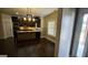 View of a spacious kitchen with stainless steel appliances, granite countertops, and dark cabinetry at 90 Alcovy Reserve Way, Covington, GA 30014