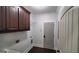 Laundry room features sleek cabinetry, basin sink, and wood flooring at 90 Alcovy Reserve Way, Covington, GA 30014