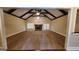 Large living room with vaulted ceiling, exposed beams, fireplace, and carpet floors at 90 Alcovy Reserve Way, Covington, GA 30014