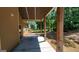 Covered patio with wooden support beams ideal for entertaining or relaxing outdoors at 90 Alcovy Reserve Way, Covington, GA 30014