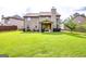 Expansive backyard with a lush lawn and covered patio, perfect for outdoor living at 697 Chapman, Jonesboro, GA 30238